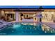 Enjoy this sparkling pool and outdoor entertaining area with a comfortable seating area and backyard views at 9148 N 66Th Pl, Paradise Valley, AZ 85253