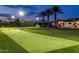 Backyard putting green and basketball court offering recreational opportunities and well manicured landscaping at 9148 N 66Th Pl, Paradise Valley, AZ 85253