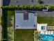 Aerial shot of a full-sized sport court, putting green, pool and manicured backyard at 9148 N 66Th Pl, Paradise Valley, AZ 85253