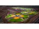 Aerial view of a lit up community sports complex with baseball fields and parking at 9738 E Tumeric Ave, Mesa, AZ 85212