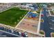 Aerial view of the community's recreational facilities including park, playground, and basketball court at 9738 E Tumeric Ave, Mesa, AZ 85212