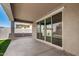Covered patio with large sliding glass doors provides seamless indoor-outdoor living at 9738 E Tumeric Ave, Mesa, AZ 85212