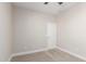 A cozy bedroom features neutral carpeting and a contemporary five panel door at 9738 E Tumeric Ave, Mesa, AZ 85212