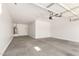 Spacious garage with sealed concrete floors and room for parking and storage at 9738 E Tumeric Ave, Mesa, AZ 85212