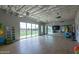 Bright community gym with natural light, wood floors, mirrors, and exercise equipment at 9738 E Tumeric Ave, Mesa, AZ 85212