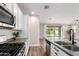 Modern kitchen features white cabinetry, stainless steel appliances, and an open layout at 9738 E Tumeric Ave, Mesa, AZ 85212