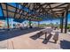 Shaded community picnic area with tables, benches, and playground nearby at 9738 E Tumeric Ave, Mesa, AZ 85212