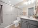Cozy bathroom boasts a single sink vanity and a shower with glass doors at 981 N Quail Ln, Gilbert, AZ 85233