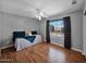 Relaxing bedroom with a fan and a large window for ample natural light and nice view at 981 N Quail Ln, Gilbert, AZ 85233