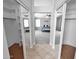 Walk-in closet featuring mirrored doors that lead to a spacious main bedroom at 981 N Quail Ln, Gilbert, AZ 85233