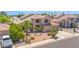 Charming two-story home has mature landscaping, desert accents, and a multi-car driveway, providing ample parking space at 981 N Quail Ln, Gilbert, AZ 85233