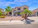 Charming two-story home featuring desert landscaping and an attached three-car garage at 981 N Quail Ln, Gilbert, AZ 85233