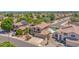A charming two-story home boasts a private pool, beautiful landscaping, and solar panels for energy efficiency at 981 N Quail Ln, Gilbert, AZ 85233