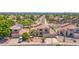 This property showcases beautiful landscaping, desert accents, and a stunning multi-car driveway with excellent curb appeal at 981 N Quail Ln, Gilbert, AZ 85233
