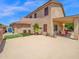 The private backyard oasis features a shaded patio, artificial grass, and low-maintenance desert landscaping at 981 N Quail Ln, Gilbert, AZ 85233