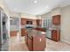 Well-equipped kitchen with a center island, stainless steel appliances, and ample cabinet space at 981 N Quail Ln, Gilbert, AZ 85233