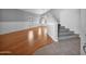 Open living area showcasing hardwood floors, wainscoting, vaulted ceilings, and lots of natural light at 981 N Quail Ln, Gilbert, AZ 85233