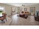 Inviting living room with tile floors, large windows, and a comfortable seating area near the pool at 981 N Quail Ln, Gilbert, AZ 85233