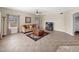 Inviting living room offers ample natural light, tile floors, comfortable seating, and a cozy atmosphere at 981 N Quail Ln, Gilbert, AZ 85233