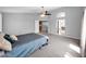 Spacious main bedroom featuring neutral tones, a comfortable king bed and views of the bathroom and staircase at 981 N Quail Ln, Gilbert, AZ 85233