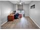 The office has wood style flooring, a ceiling fan and great natural light from the window at 981 N Quail Ln, Gilbert, AZ 85233