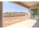 Covered patio leading to a spacious backyard with mountain views at 10013 S 36Th Ave, Laveen, AZ 85339