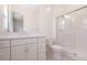 Well-lit bathroom featuring a glass shower, toilet, and vanity with ample storage space at 10013 S 36Th Ave, Laveen, AZ 85339