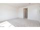 Bedroom with light carpet, white walls and natural light through large windows at 10013 S 36Th Ave, Laveen, AZ 85339