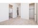 Bedroom featuring neutral carpet with multiple doorways that lead to closet and bathroom at 10013 S 36Th Ave, Laveen, AZ 85339