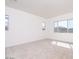 Bright bedroom with neutral carpet and large windows offering natural light at 10013 S 36Th Ave, Laveen, AZ 85339