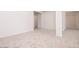 Hallway with plush carpeting and white walls provides access to rooms at 10013 S 36Th Ave, Laveen, AZ 85339