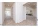 Hallway shows the interior architecture, neutral walls, and access to the kitchen at 10013 S 36Th Ave, Laveen, AZ 85339