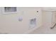 Utility room with washer and dryer hookups with clean white walls at 10013 S 36Th Ave, Laveen, AZ 85339