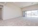 Spacious, bright living room with access to the backyard through a large glass sliding door at 10013 S 36Th Ave, Laveen, AZ 85339