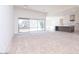 Bright and open living space with large sliding glass doors leading to the backyard at 10013 S 36Th Ave, Laveen, AZ 85339
