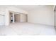 Bright, carpeted living room showing open floor plan and access to adjacent rooms at 10013 S 36Th Ave, Laveen, AZ 85339