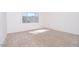 Carpeted room with mountain views through the window at 10013 S 36Th Ave, Laveen, AZ 85339