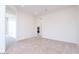 Bright, carpeted room with neutral walls and an open layout at 10013 S 36Th Ave, Laveen, AZ 85339