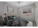 Comfortable bedroom with neutral tones, plush carpeting, and a large window at 10141 E Floriade Dr, Scottsdale, AZ 85260
