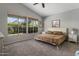 Bright bedroom with large windows, plush carpet, and neutral color palette at 10141 E Floriade Dr, Scottsdale, AZ 85260