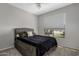 Bright bedroom with neutral tones, plush carpeting, and a view of the outdoors at 10141 E Floriade Dr, Scottsdale, AZ 85260