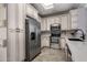 Updated kitchen boasts white cabinets, stainless steel appliances, and ample storage space at 10141 E Floriade Dr, Scottsdale, AZ 85260