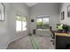 Office with ample lighting from windows and an indoor putting green at 10141 E Floriade Dr, Scottsdale, AZ 85260