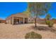 Spacious backyard with covered patio, desert landscaping, and room for outdoor activities at 1254 E Thomas Dr, Casa Grande, AZ 85122