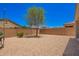 Private backyard with low-maintenance landscaping, enclosed by a sturdy block wall for added privacy at 1254 E Thomas Dr, Casa Grande, AZ 85122