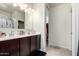 Bathroom has a double sink vanity and a door leading to a walk in closet at 1254 E Thomas Dr, Casa Grande, AZ 85122