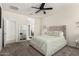 Comfortable bedroom with neutral walls, carpeted floors, and ceiling fan at 1254 E Thomas Dr, Casa Grande, AZ 85122