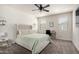 Comfortable bedroom with neutral walls, carpeted floors, ceiling fan, and windows at 1254 E Thomas Dr, Casa Grande, AZ 85122
