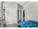 Bright bedroom with closet and open doorway, offering a view of connecting rooms at 1254 E Thomas Dr, Casa Grande, AZ 85122