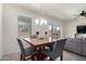 Cozy dining area with seating for four, bathed in natural light, and adjacent to the living area at 1254 E Thomas Dr, Casa Grande, AZ 85122